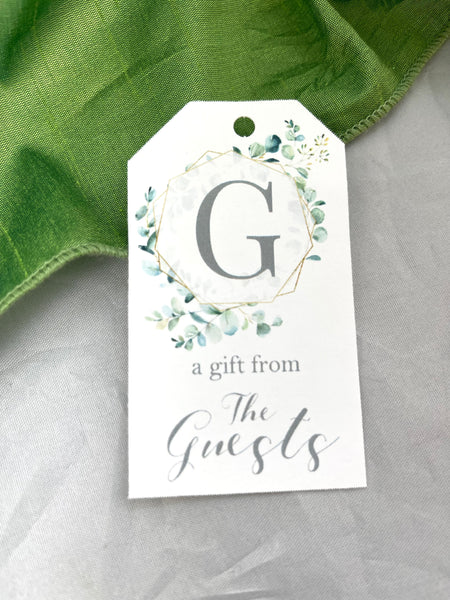 Initial gift tags with greenery